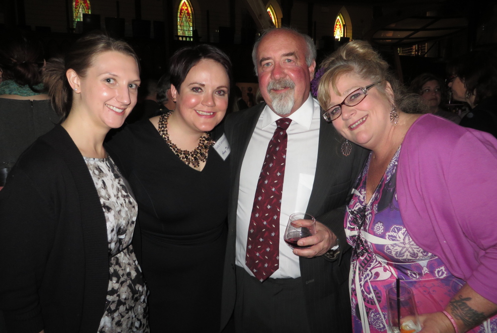 Volunteer Jessica Watson, left, board member Amy Taylor, Craig Aderman of Freeport and Michelle Locke of Brunswick support the work of Family Crisis Services at a gala at Grace restaurant in Portland.