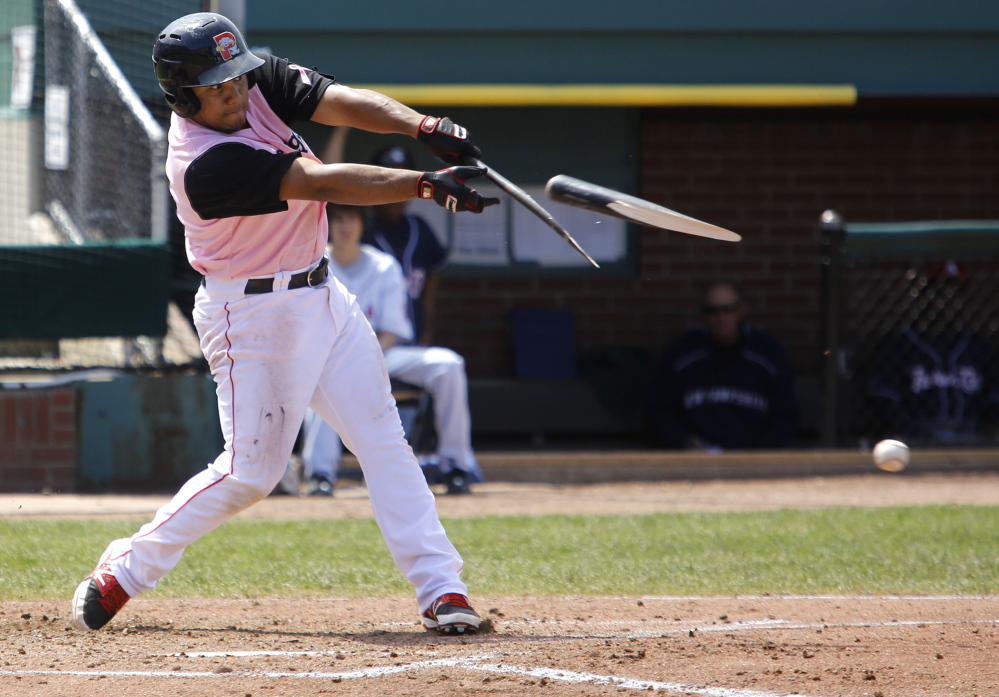 Heiker Meneses of the Sea Dogs breaks his bat early in Sunday’s game against New Hampshire. Meneses capped a four-run ninth inning with an RBI single that gave the Sea Dogs a 13-12 victory.