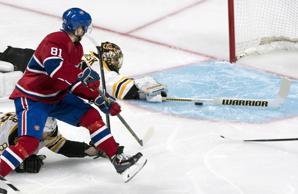 Montreal Canadiens’ Lars Eller (81) scores on Boston Bruins goalie Tuukka Rask during the first period Monday night in Montreal.