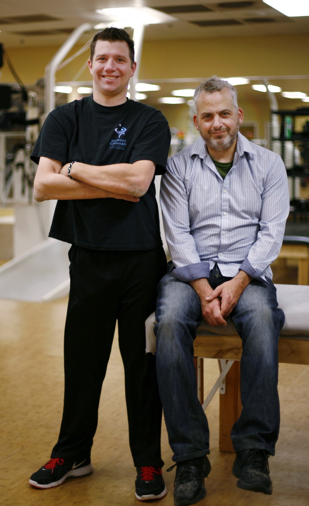 Documentary filmmaker David Fresina, right, poses with Dan Cummings at Journey Forward, Cummings’ center to help people recover from spinal cord injuries in Canton, Mass.