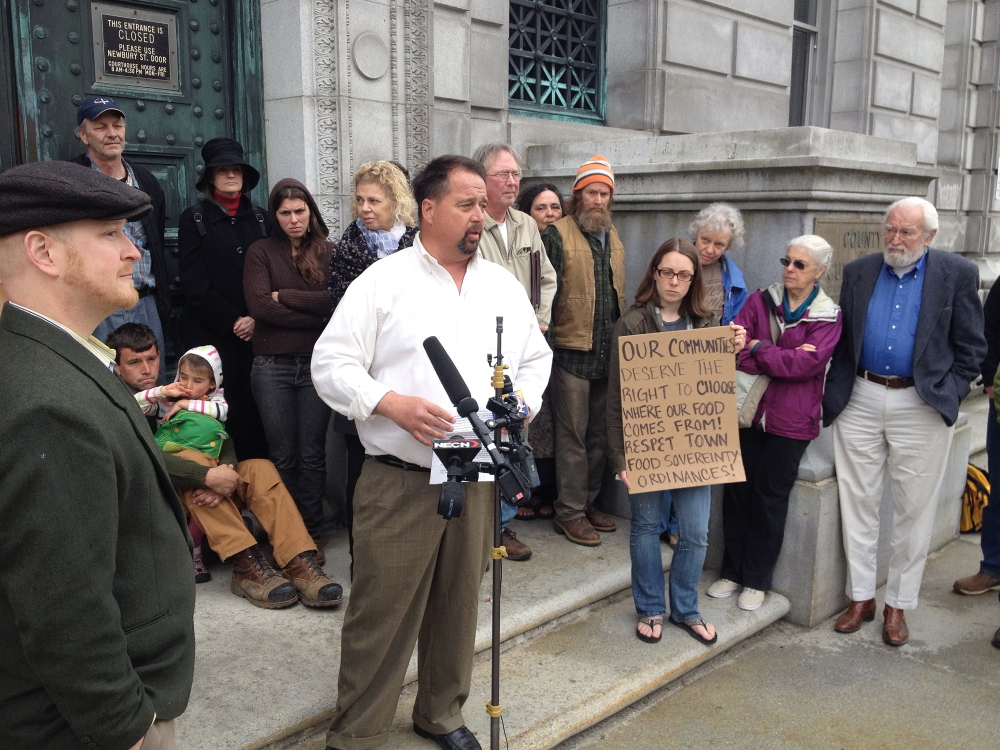 Surrounded by supporters on the steps of the Cumberland County Courthouse in Portland on Tuesday, Dan Brown of Blue Hill speaks to the media about his case before the Maine Supreme Judicial Court.