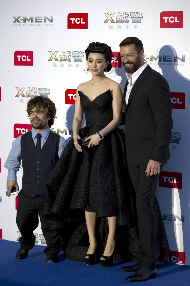 Hugh Jackman, right, and Chinese co-star Fan Bingbing pose at the opening of their film in Beijing on Tuesday.