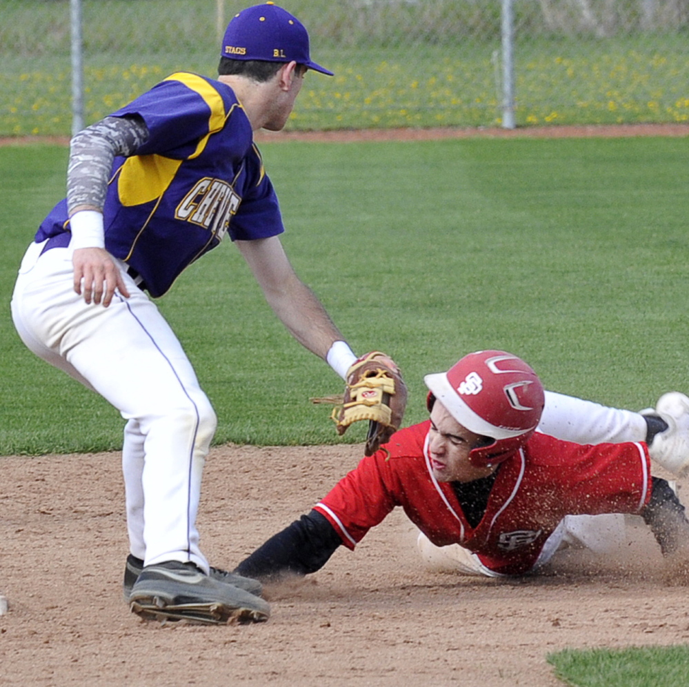 Cheverus’ Felix del Vecchio puts a tag on South Portland’s Robert Graff at second base. The Red Riots went on to take a 2-0 home win Tuesday over the Stags.