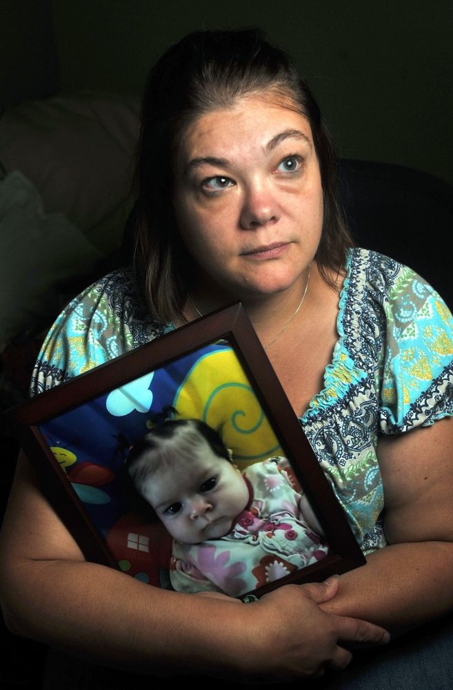 Nicole Greenaway of Clinton holds a picture of her baby, Brooklyn Foss-Greenaway, who died while in the care of a family friend in 2012.