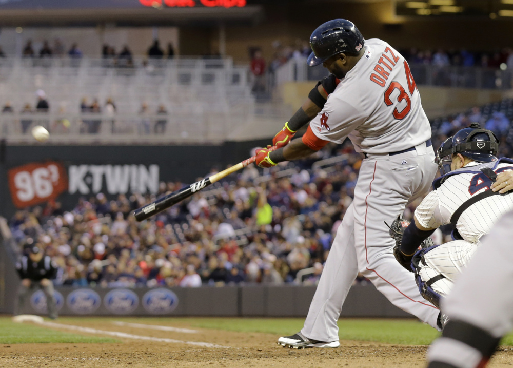 Boston Red Sox designated hitter David Ortiz hits a solo home run off Minnesota Twins relief pitcher Caleb Thielbar in the fifth inning in Minneapolis on Wednesday.