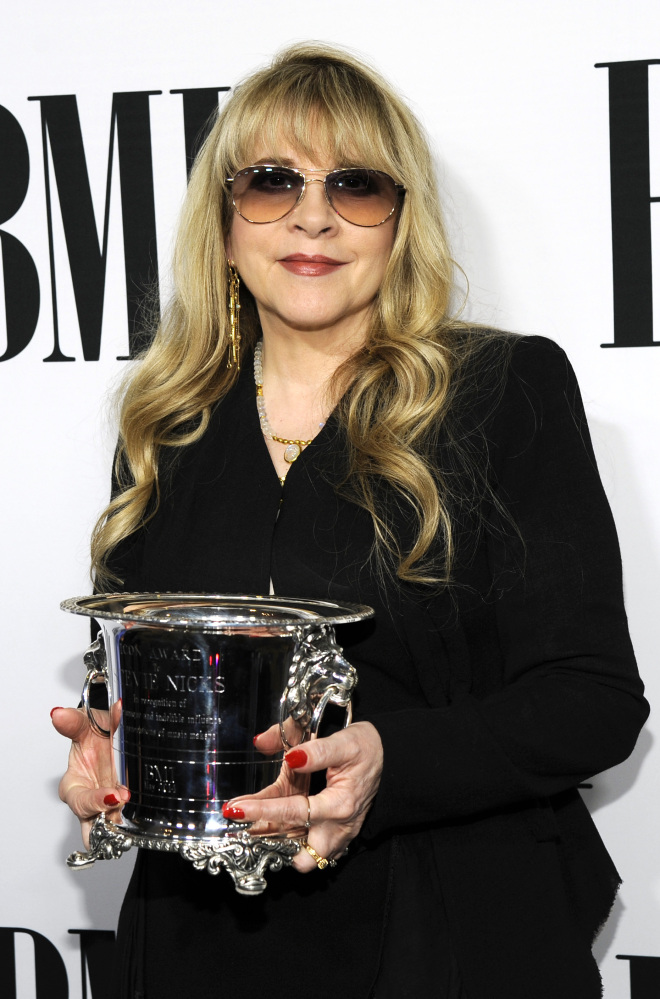 Stevie Nicks of fleetwood Mac poses with the BMI Icon Award at the Beverly Wilshire Hotel on Tuesday in Beverly Hills, Calif.