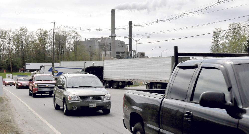Workers leave the Sappi paper mill in Skowhegan on Wednesday. The parent company has announced a 5 percent reduction in its nationwide workforce.