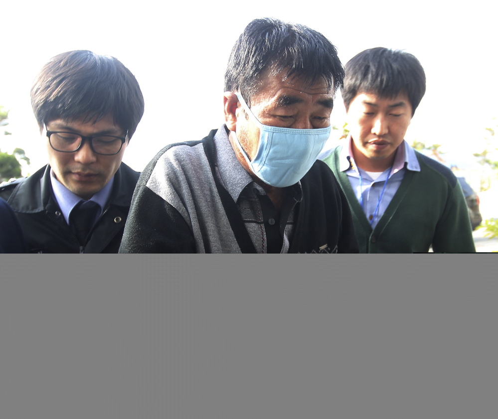 Lee Joon-seok, the captain of the sunken ferry Sewol, arrives at the headquarters of a joint investigation team of prosecutors and police in Mokpo, South Korea, in this April 19, 2014, photo.