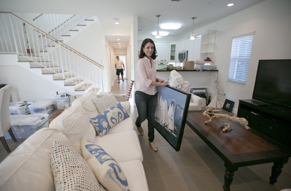 Marisa Salas, owner of the home-staging company, Showhomes, decorates a home in Little Gables, Fla., for sale. “We create the emotional aspect of a house,” Salas says.