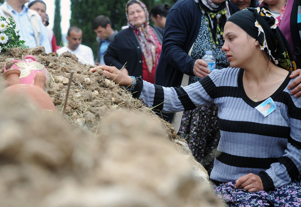 Family members attend a funeral for a victim of the mine accident in Soma, Turkey, on Thursday. Mourners say they spend their lives fearing a disaster at the mine.