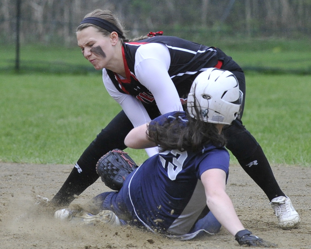 Maddie Taylor of Wells tags out Yarmouth’s Cat Thompson during their Western Maine Conference softball game Friday in Wells. Taylor finished with three hits to help the Warriors improve to 9-1 with a 15-10 victory.