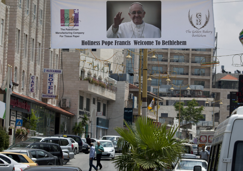 A welcome banner with a picture of Pope Francis hangs over a street near the Church of the Nativity in the West Bank city of Bethlehem. The church is one of the stops the pope will make during his upcoming visit to the Holy Land.
