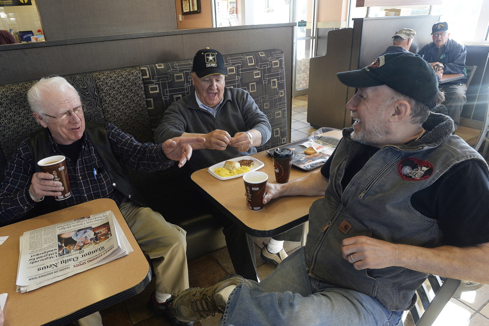 From left, Ray Campagna, 81, Earl Pelletier, 64, and Joe LaChance, 68, all of Madawaska, talk politics at the local McDonald’s. The three men cited a variety of reasons, from religious to personal, for opposing Mike Michaud.