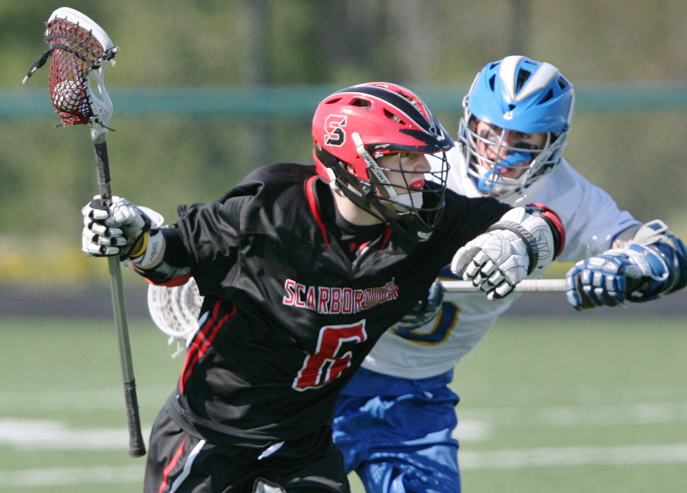 Scarborough’s Nathan Howard, left, is defended by Tyler Jordan of Falmouth in a matchup of perennial lacrosse powers. The Red Storm couldn’t recover from a 10-0 early deficit.