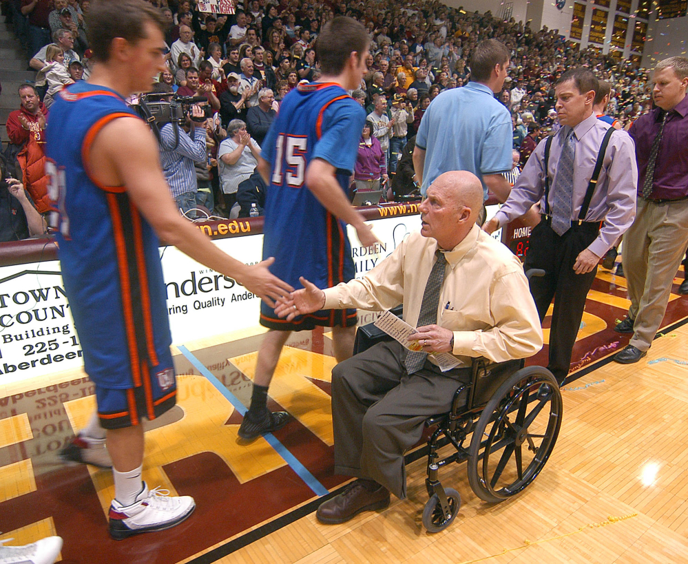 Don Meyer, then Northern State University men’s basketball coach, shakes hands with a University of Mary player after he got his 903rd win, passing Bobby Knight as the NCAA’s winningest coach in men’s basketball history, in Aberdeen, S.D., in 2009