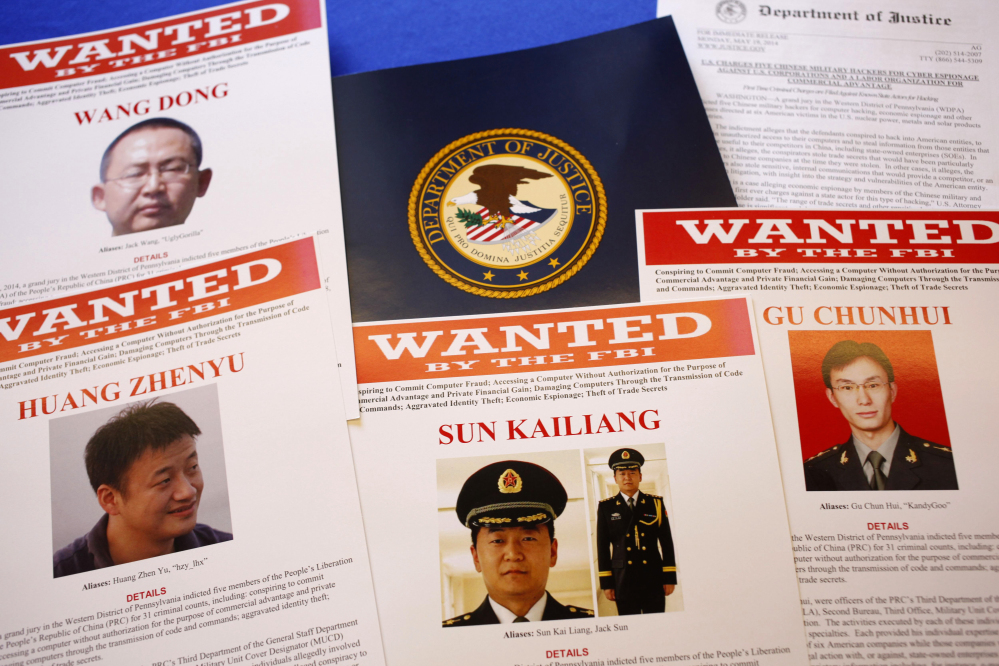Wanted posters are displayed on a table of the Justice Department in Washington on Monday.