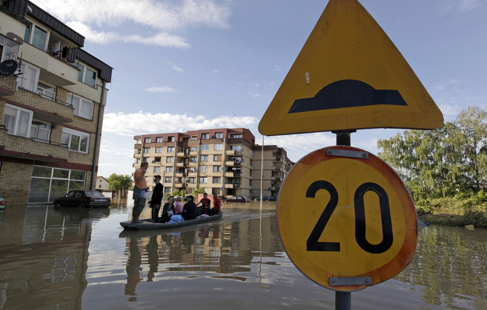 Residents are evacuated by boat in Bosanski Samac, a town in northeastern Bosnia on the banks of the Sava River.