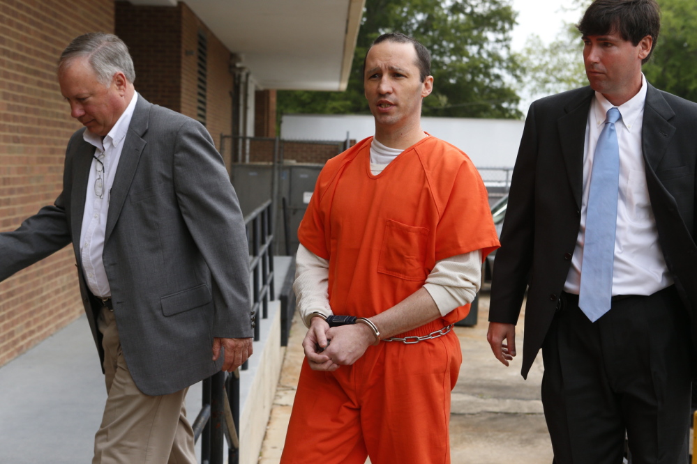 James Everett Dutschke is lead by U.S. marshals into the Federal Building in Aberdeen, Miss., on May 13.