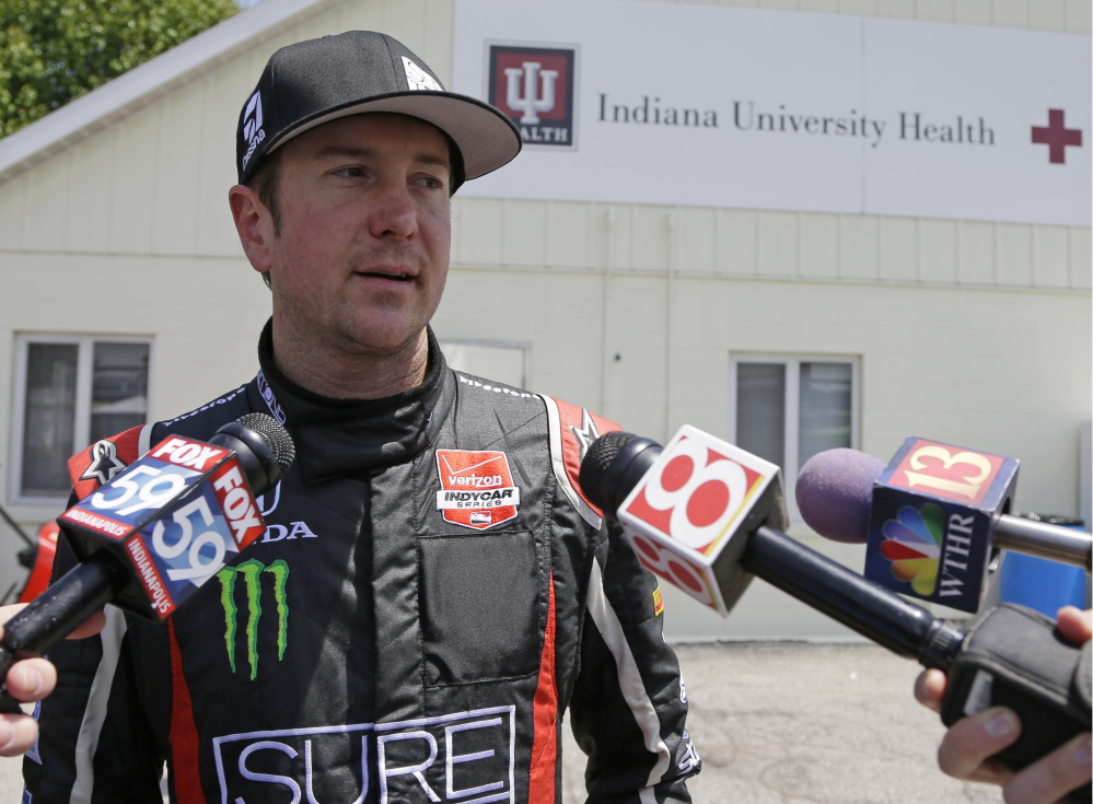 Kurt Busch is interviewed as he leaves the track medical center after he crashed in the second turn during practice for the Indianapolis 500 IndyCar auto race at the Indianapolis Motor Speedway on Monday. He was cleared to drive.