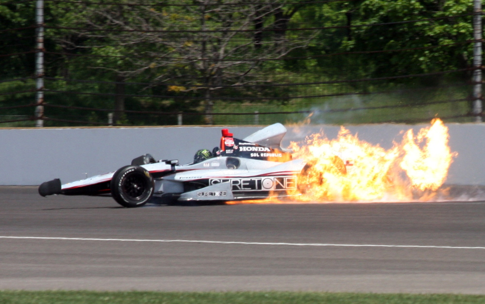 The car driven by Kurt Busch catches fire after hitting the wall in the second turn during practice for the Indianapolis 500 IndyCar auto race at the Indianapolis Motor Speedway on Monday.