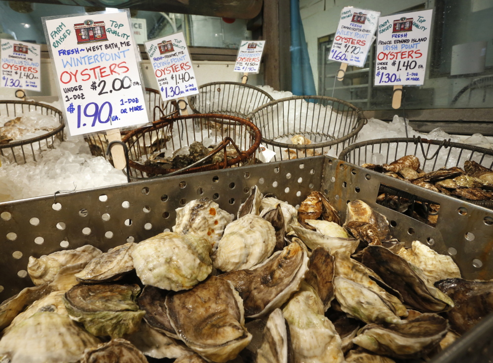 Locally harvested oysters for sale at Harbor Fish Market have signs that are clear about their source – fresh and farm-raised in West Bath or from other local waters.