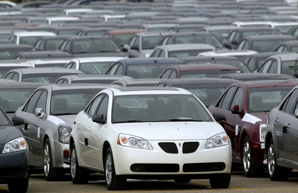 2006 Pontiac G6s are lined up outside the General Motors Orion Assembly plant in Orion Township, Michigan. General Motors is recalling 2.4 million vehicles in the U.S., including Pontiac G6s from the 2005-2008 model years.