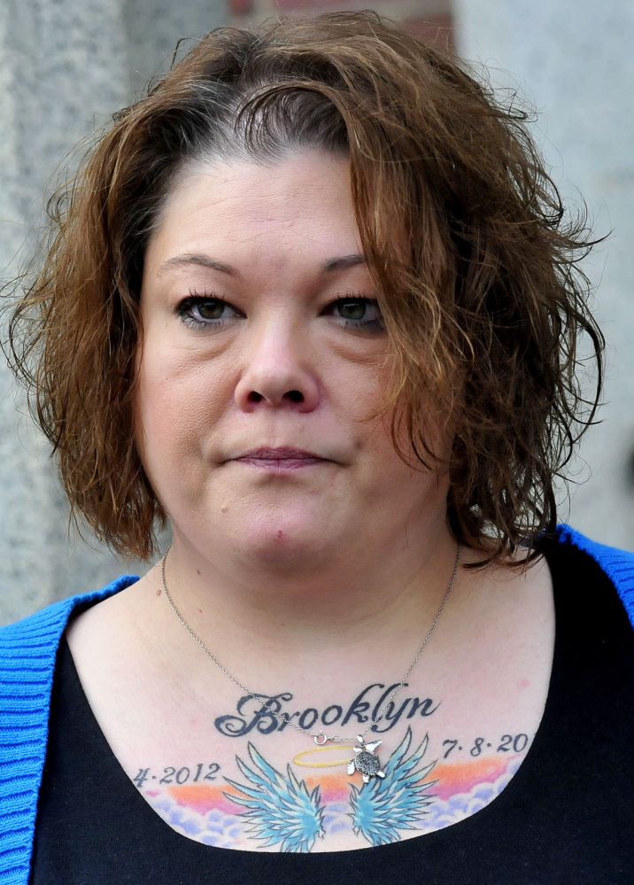 Nicole Greenaway shows a tattoo she got in memory of her daughter Brooklyn, a 3-month-old who was killed by Kelli Murphy in 2012. “Maybe I can start moving forward,” she said after court Wednesday.