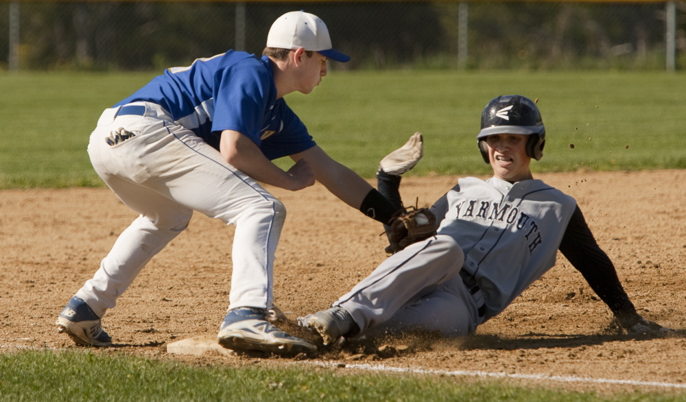 Falmouth third baseman Noah Nelson places the tag on C.J. Cawley of Yarmouth during Falmouth’s 12-2 victory Wednesday in a Western Maine Conference game. The Yachtsmen improved to 9-2 and dropped Yarmouth to 6-5.