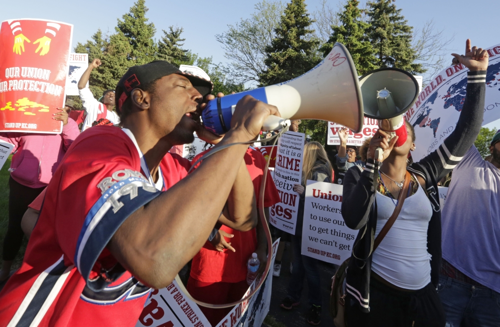Hundreds of protesters gather outside of the McDonald’s Corp. Thursday in Oak Brook, Ill., demonstrating for a $15 hourly wage and the right to unionize. The group gathered outside the entrance to the company’s headquarters during the annual shareholders meeting.