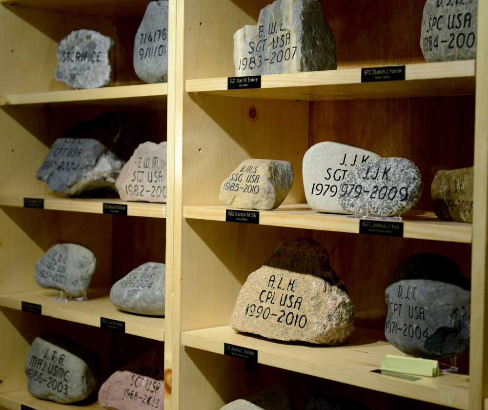 Memorial stones are on display in the Military Entrance Processing Station on Congress Street in Portland.