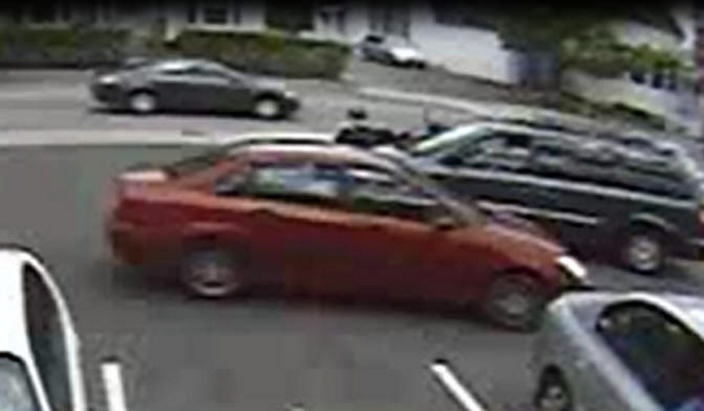 The woman who is believed to have taken a donation jar from Dunkin’ Donuts was driving this maroon sedan.