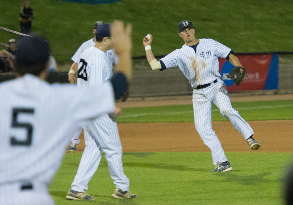 University of Southern Maine shortstop Sam Dexter holds his throw after fielding a ball that deflected off pitcher Alex Tobey during the seventh inning of an 8-1 loss to Wisconsin-Whitewater in the NCAA Division III championships Friday night at Appleton, Wis.