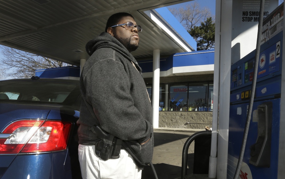 To avoid becoming a carjacking victim, Greg Champion wears a gun on his hip whenever he’s pumping gas. Through May 19, Detroit has recorded 191 carjackings this year.