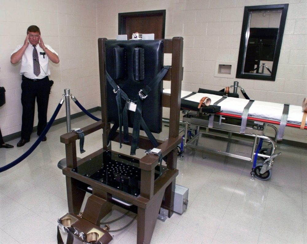Ricky Bell, then warden at Riverbend Maximum Security Institution in Nashville, Tenn., gives a tour of the execution chamber in 1999. Gov. Bill Haslam signed a bill into law on Thursday allowing electrocution if drugs for lethal injection cannot be obtained.