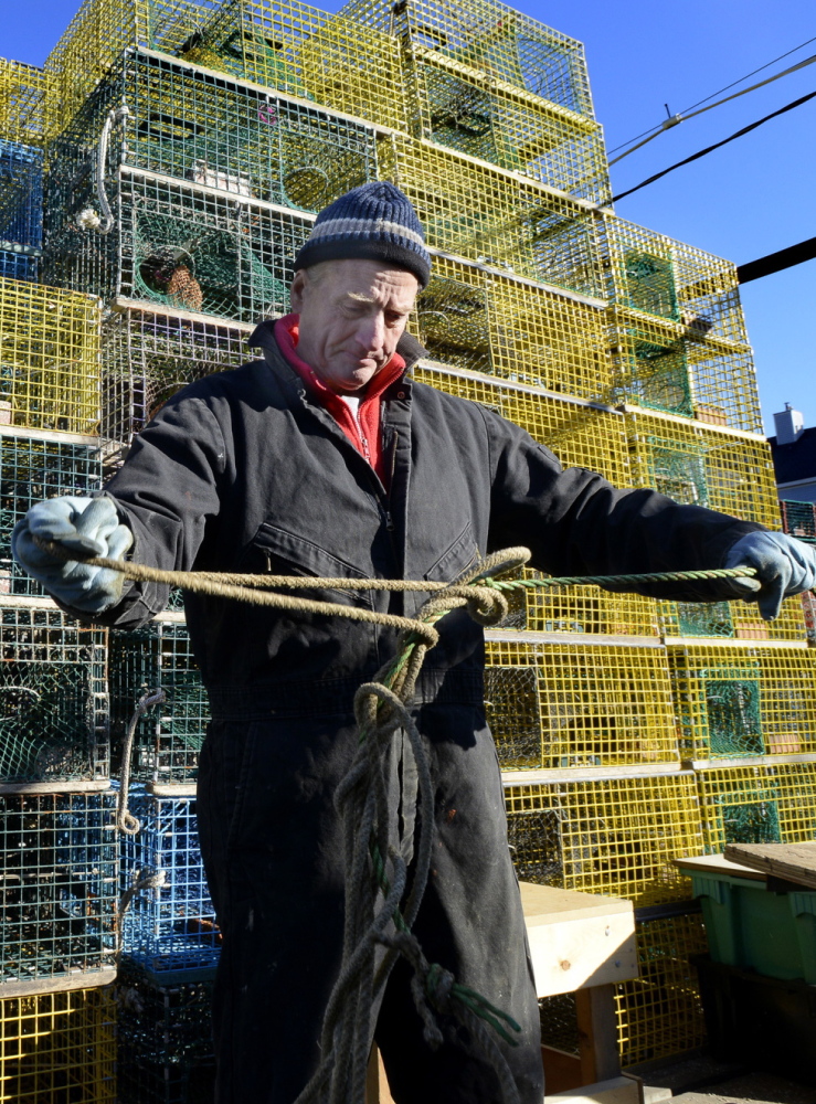 Portland fisherman David MacVane, 80, tends to lobster traps. Ocean acidification threatens all shellfish.