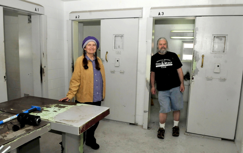 Annie Stillwater Gray and Timothy Smith visit the former Somerset County Jail’s cellblock E13 on Thursday. With donated rent, CDs and a computer and with funds that they are still raising, they plan to turn the prison space into a community-centered, noncommercial radio studio.