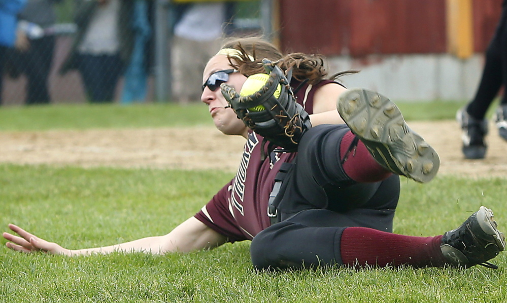 Thornton Academy first baseman Erin Brayden makes a diving catch of a foul popup, one of several strong defensive plays made Saturday by the Trojans in support of pitcher Bailey Tremblay on the way to a 5-0 softball win over Biddeford.