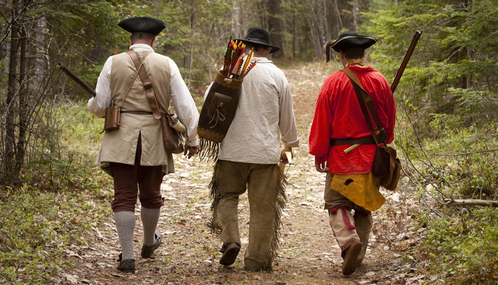 The three amigos? Well you can call them that – a trio of Ancient Ones who dress the part while walking in the woods during a rendezvous in Canton.