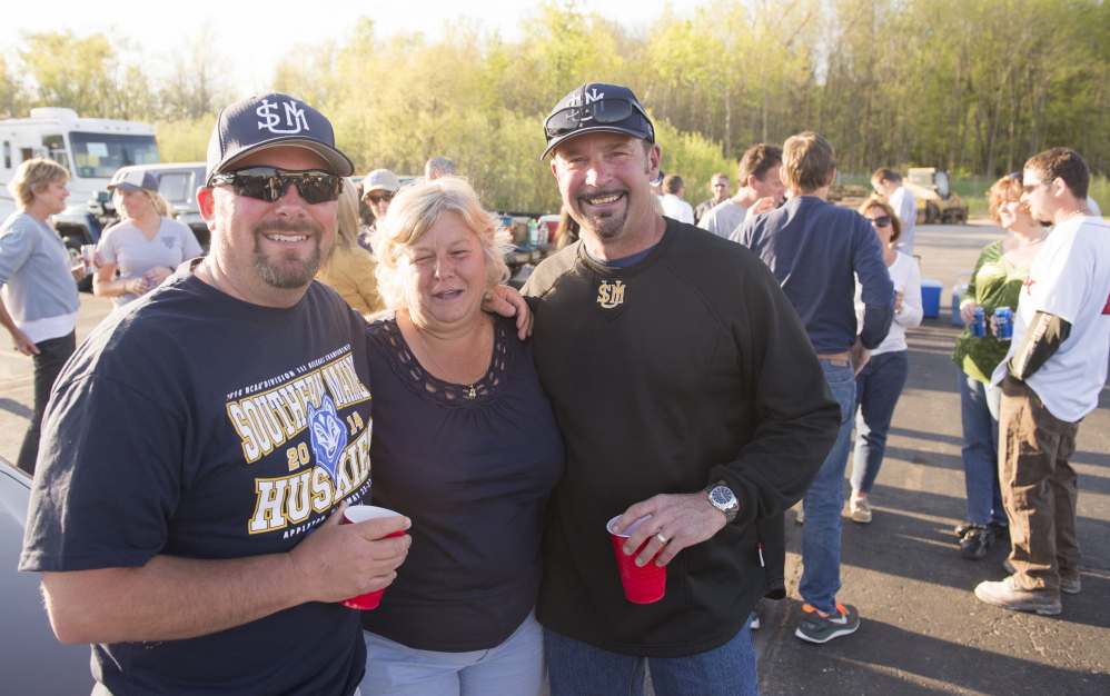 David Verrier, left, Theresa Carey, middle, and Matt Glauser, right, are part of a group of parents who followed the University of Southern Maine baseball team to Appleton, Wis., for the Division III championships.
