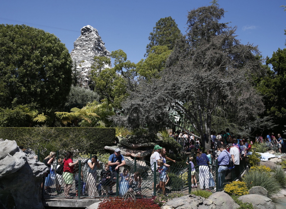 Patrons stand in long lines at Disneyland. “Our goal is to always provide the best possible experience for all of our guests,” said Disneyland spokeswoman Suzi Brown.