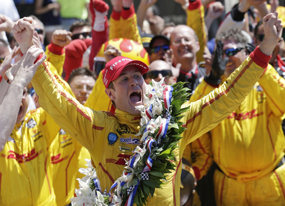 Ryan Hunter-Reay celebrates winning the 98th running of the Indianapolis 500 IndyCar auto race at the Indianapolis Motor Speedway in Indianapolis, Sunday.