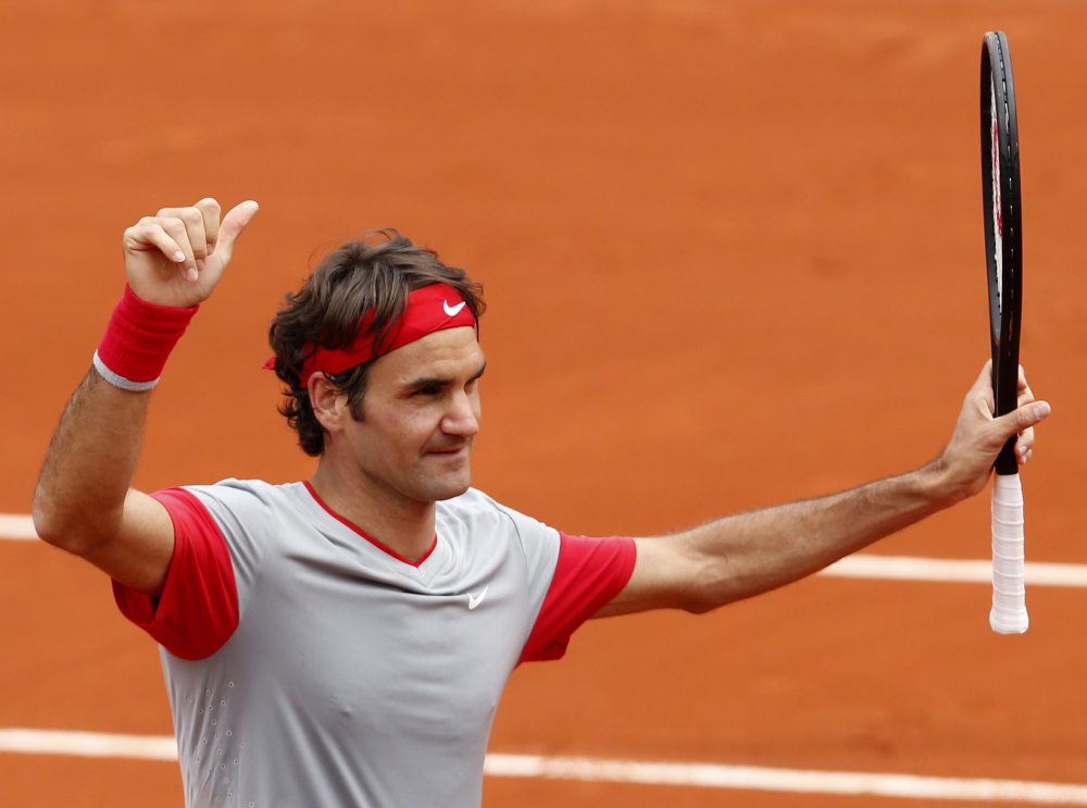 Roger Federer gives the thumbs up after defeating Lukas Lacko in the first-round match of the French Open tennis tournament at the Roland Garros stadium, in Paris, France, on Sunday. Federer won 6-2, 6-4, 6-2.