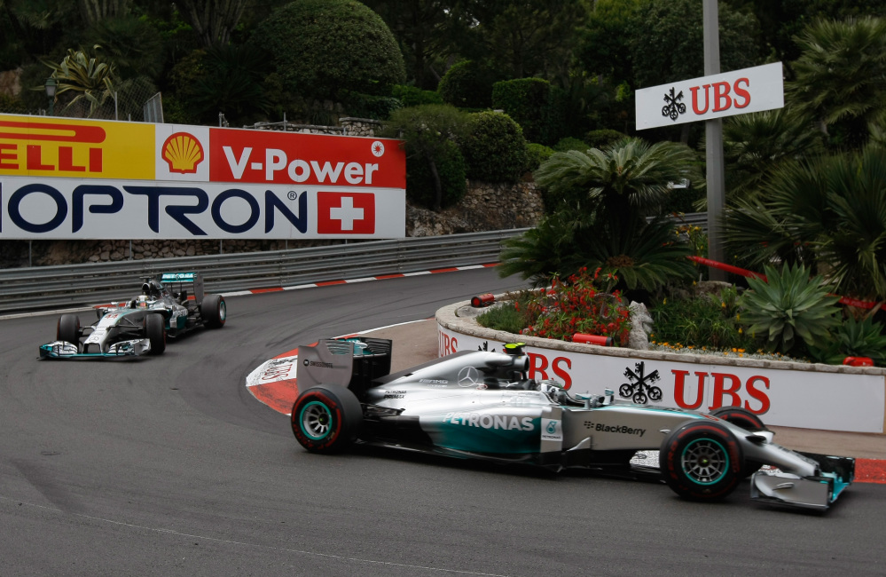 Mercedes driver Nico Rosberg of Germany leads Mercedes driver Lewis Hamilton of Britain , during the Monaco Formula One Grand Prix, at the Monaco racetrack, in Monaco, Sunday.
