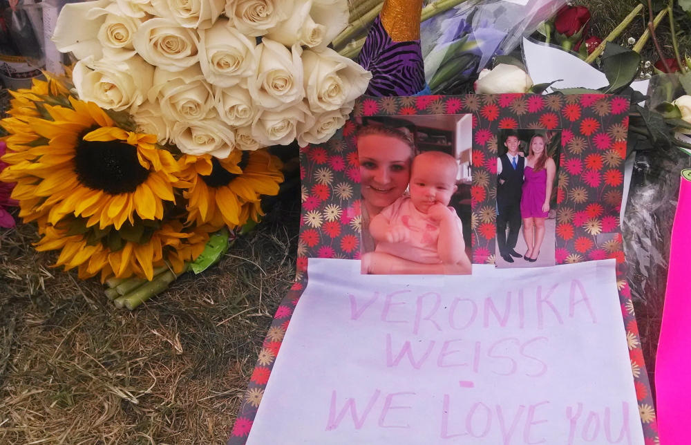 Flowers, photos and a note adorn a sidewalk memorial for a victim of a shooting rampage outside the Delta Phi sorority house in Goleta, Calif., Monday.