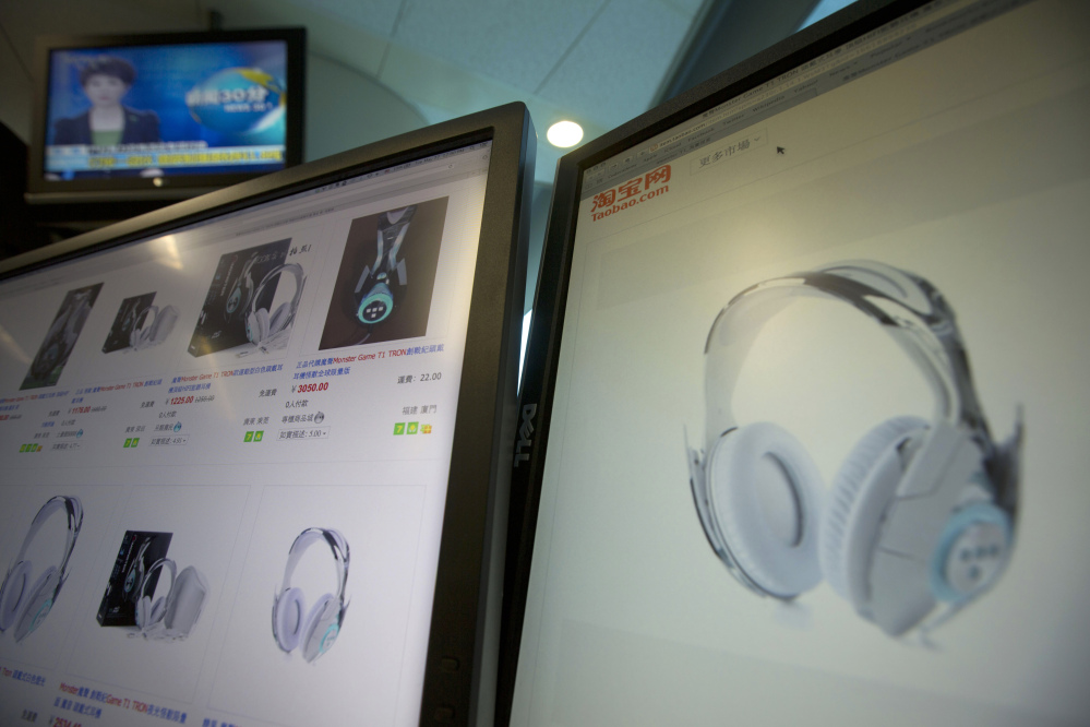 Computer screens display the website of Alibaba’s Taobao site selling the Monster Tron T1 headphones, in Beijing on Tuesday. But buyer beware because Monster Inc. never produced this model.