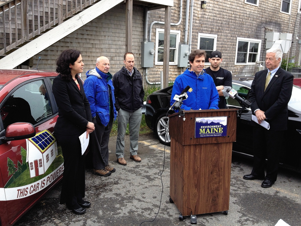 Phil Coupe, co-founder of ReVision Energy, speaks about the benefits of solar energy at a news conference Tuesday at Becky’s Diner in Portland. Other participants are, from left, Emily Figdor of Environment Maine, who ran the event, Portland Mayor Michael Brennan, developer Tim Soley, Zach Rand of Becky’s and U.S. Rep. Mike Michaud, D-Maine.