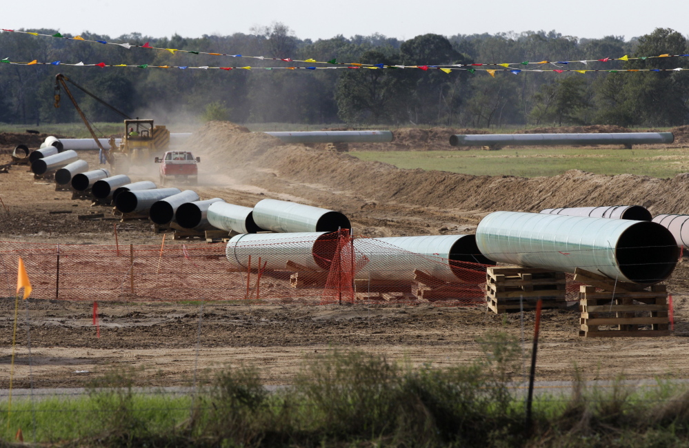 Large sections of pipe are shown in Sumner, Texas. Safety regulators have placed two extra conditions on construction of TransCanada Corp.’s Keystone XL oil pipeline.