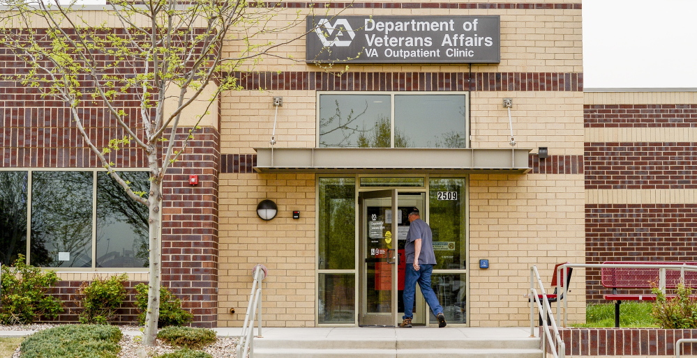 A man enters the Department of Veterans Affairs Outpatient Clinic in Fort Collins, Colo. One of the tricks used by employees to meet appointment time limits included making appointments, but not telling the patient.