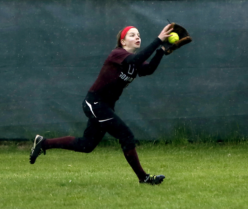 Courtney Roberts makes a running catch for Gorham, which couldnât hold on to a late lead against South Portland.