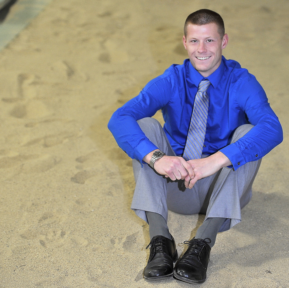 GORHAM, ME - MAY 29: Portrait of Jamie Ruginski, triple jump champion, in the sand pit he calls home, at Costello Fieldhouse on USM campus in Gorham. (Photo by Gordon Chibroski/Staff Photographer)